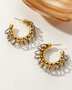 Golden hoop earrings with silver rings dangling