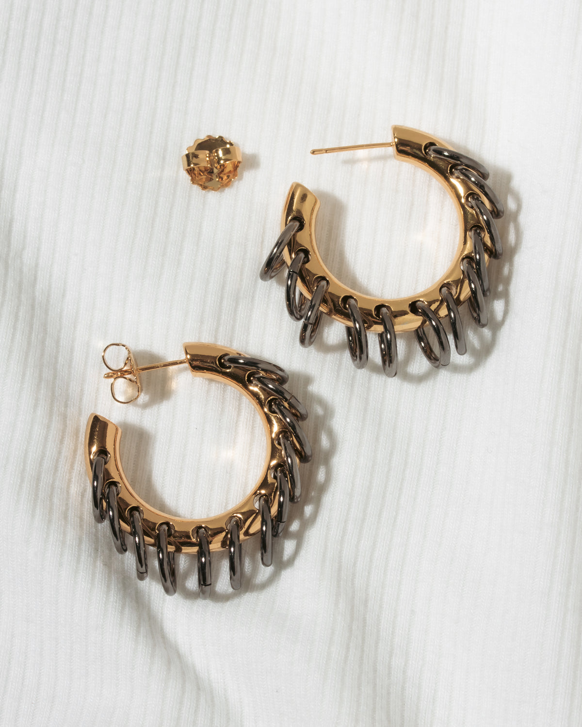 Chunky gold and oxidized gun metal plating post hoop with hanging links.