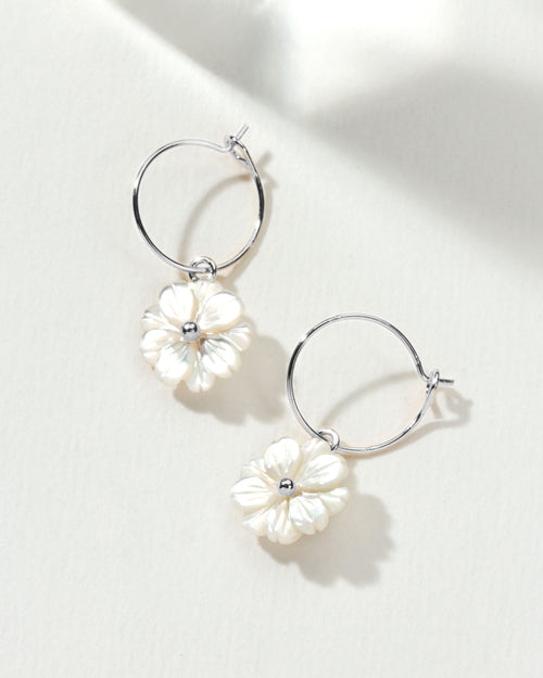 A pair of Blooming Hoop Earrings Silver, featuring delicate mother of pearl daisies.
