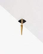 Unity Solo Stud Earring with dual-sided black pyramid stone and gold spike hanging from the bottom.