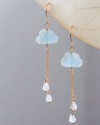 Aquamarine cloud-shaped earrings with gold chains and white moonstone rain drop stones