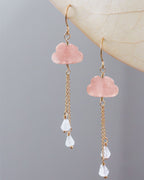 Pair of pink opal cloud-shaped earrings with gold chains and white moonstone beads