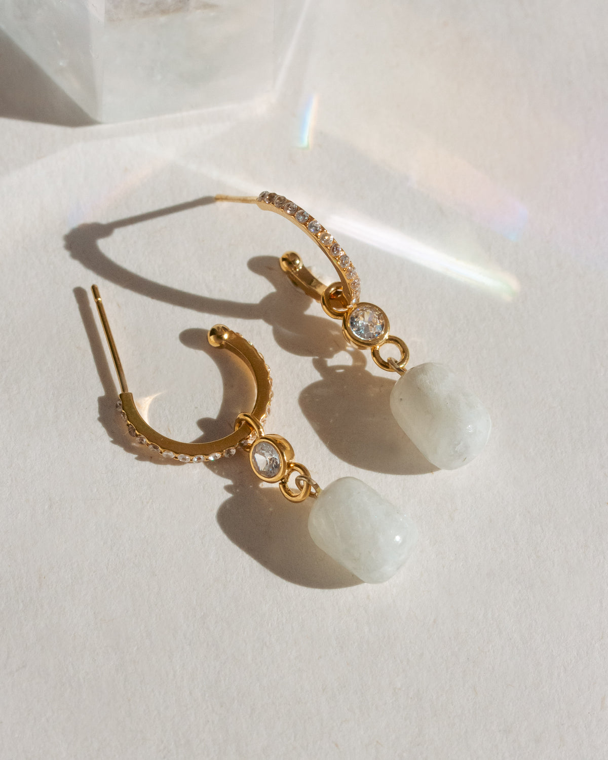 Gem Capsule Hoop Earrings with Moonstone gemstones and CZs in gold settings.