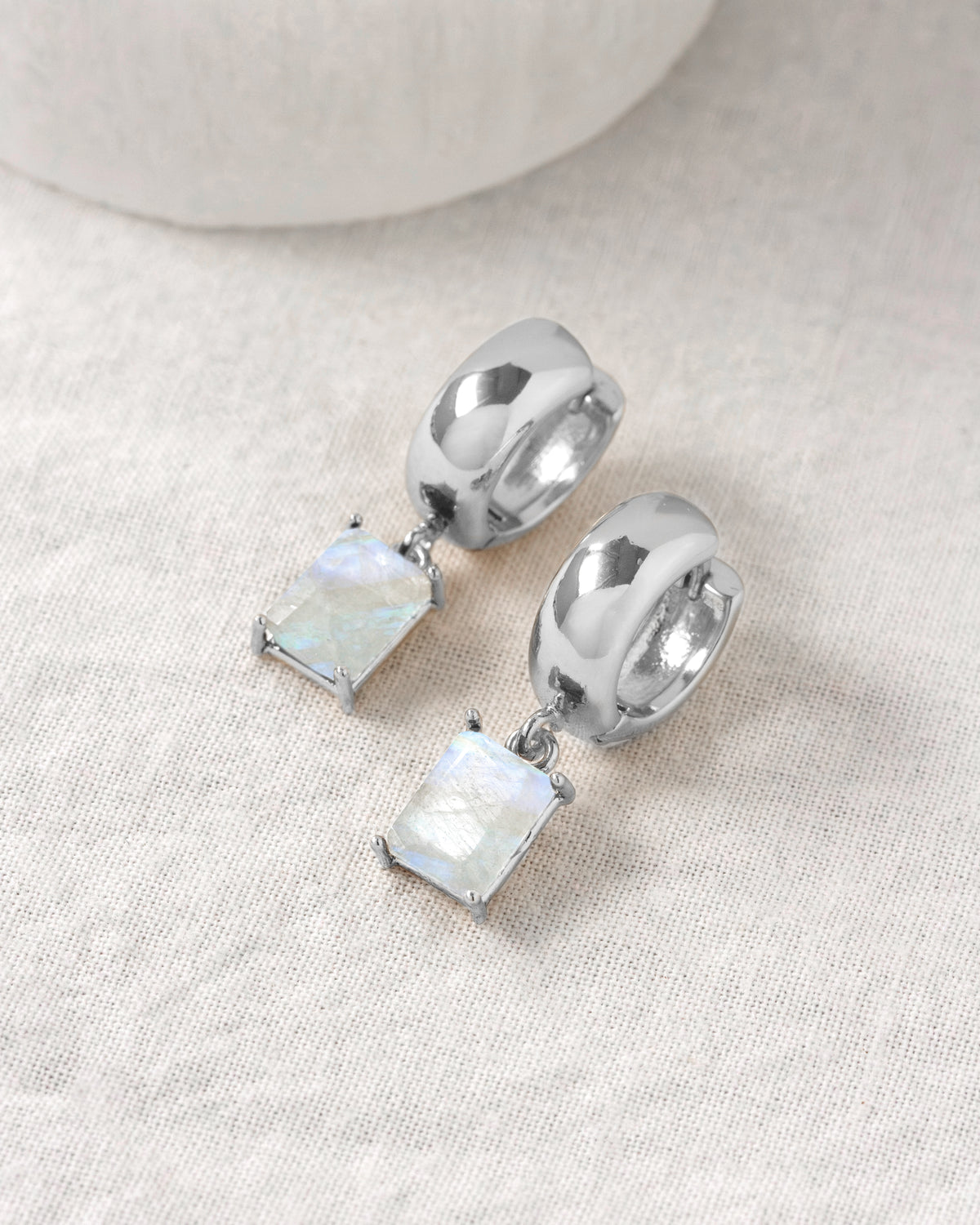 Silver plated wide huggie hoop earring with bezel set moonstone charm