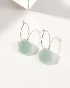 Aquamarine geometric shaped sterling silver hoop hearings on a white background.
