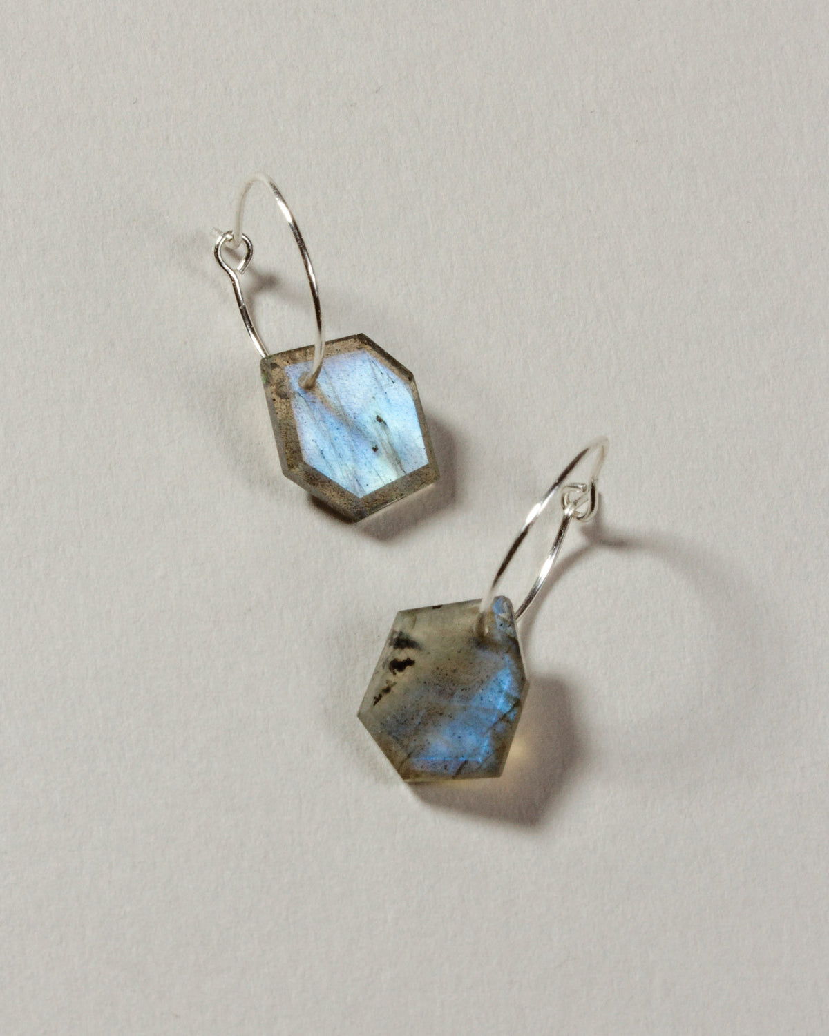 Labradorite geometric shaped sterling silver hoop hearings on a white background.