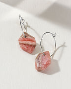 Pink Rhodochrosite geometric shaped sterling silver hoop hearings on a white background.