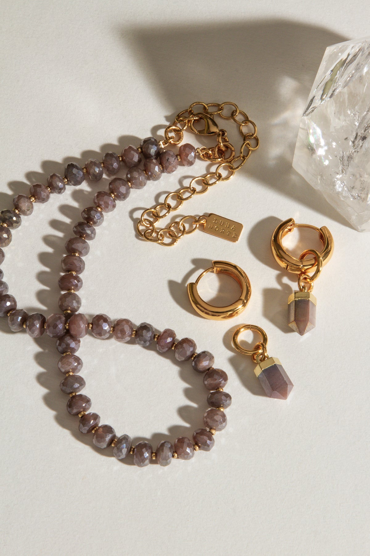 Java Jewel beaded collar necklace in Coffee Moonstone with matching earrings and a Quartz crystal.
