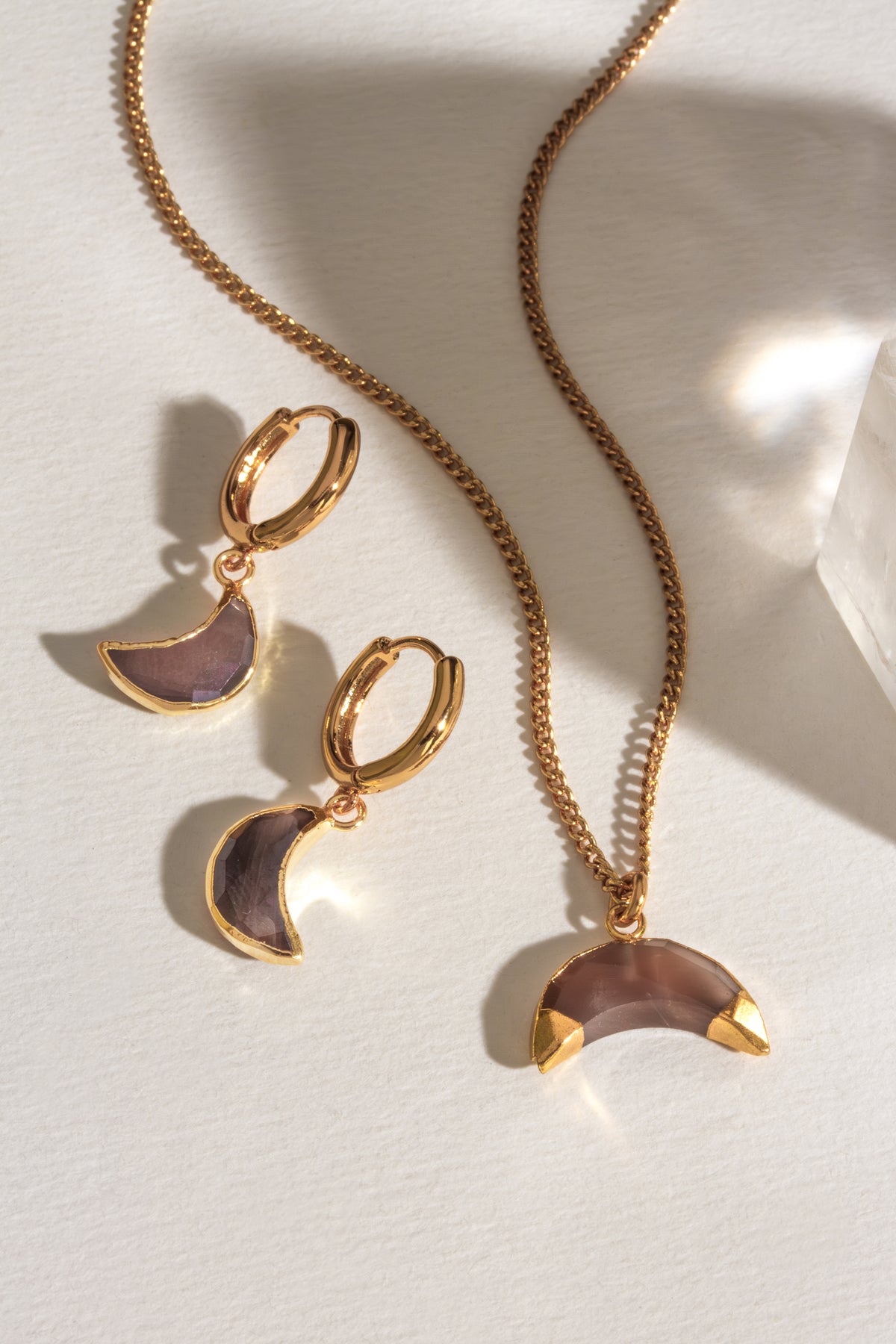 Gold "Espresso Yourself" necklace and hoop earring set featuring coffee moonstone crescent pendants.