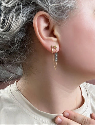 Customer submitted image showing double pierced style on gray haired customer