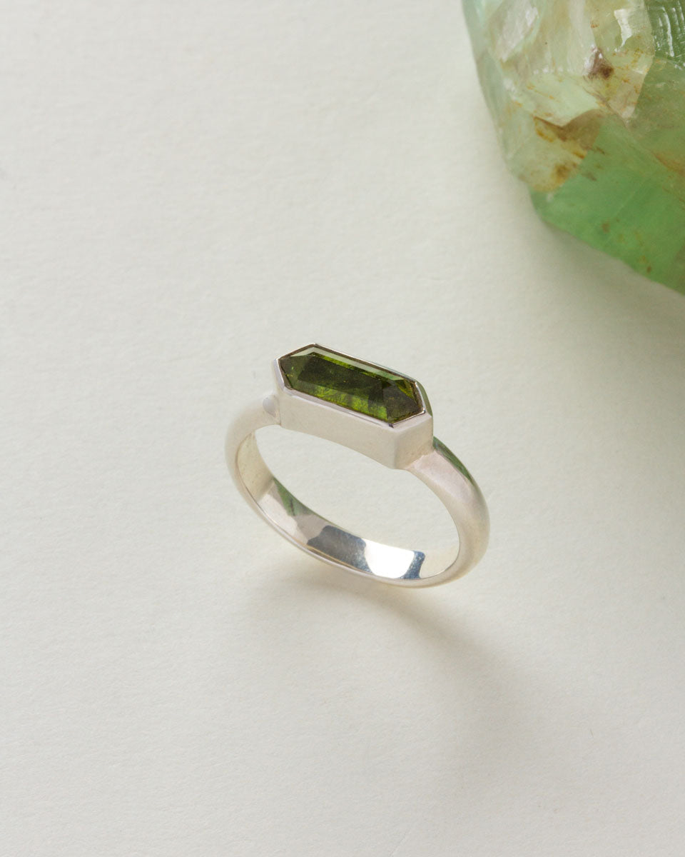 Silver Kaleidoscope ring with a Green Tourmaline gemstone.