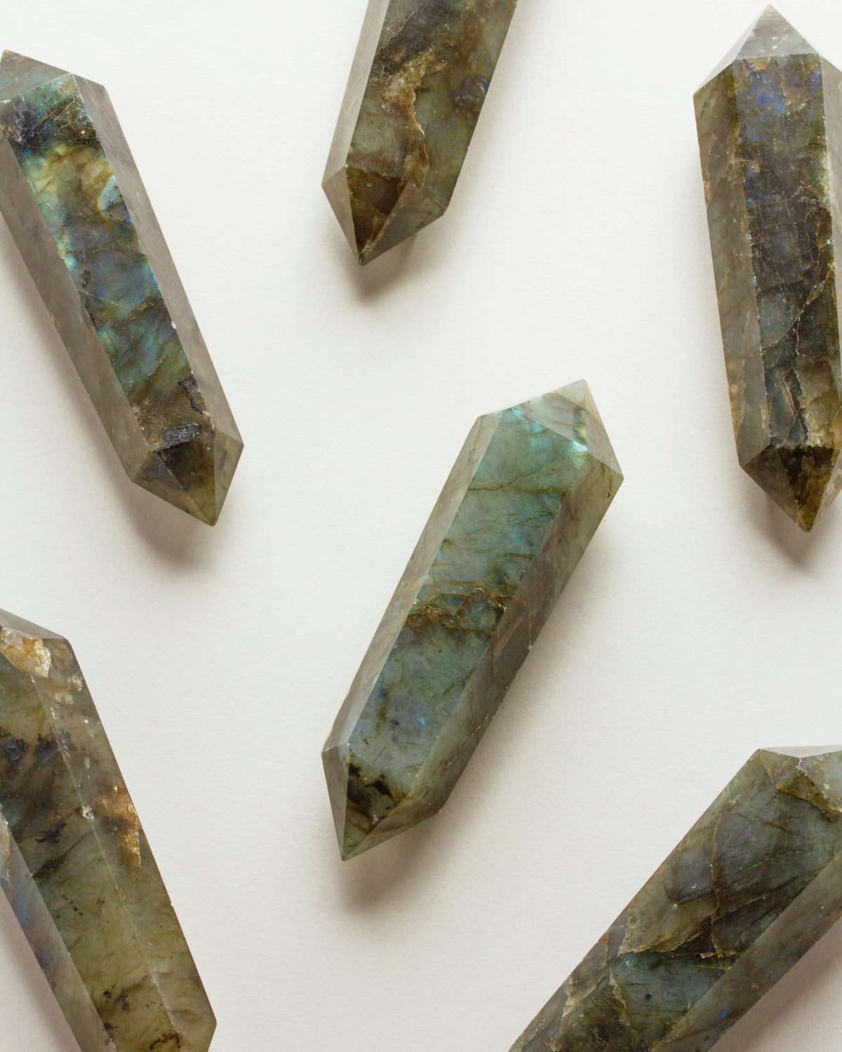 Several Labradorite Double Point Crystals on a white background.