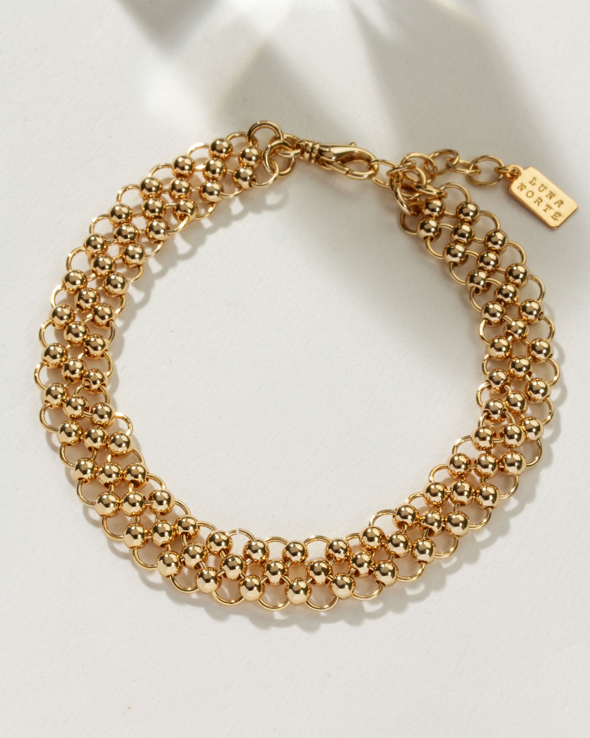 Gold-tone Chain Maille Anklet with clasp and extender detail.