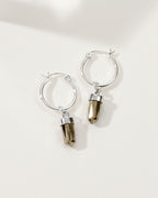 Silver hoop earrings with pyrite charms.