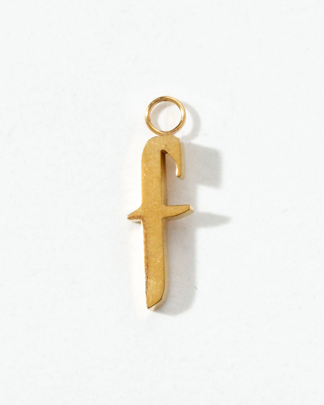Gold letter "f" pendant on a white background