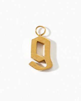 Gold letter 'q' pendant on a white background