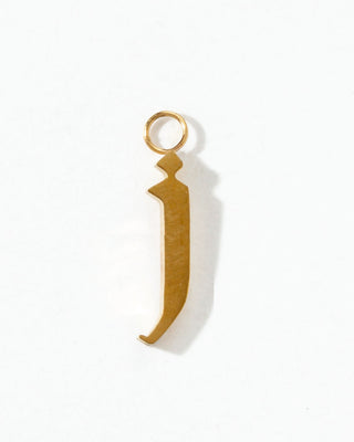 Gold pendant shaped like the letter 'J' on a white background