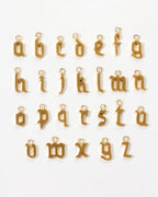 Alphabet of gold letter charms A through Z