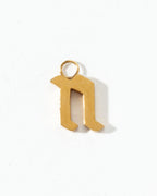 Gold letter 'n' pendant on a white background