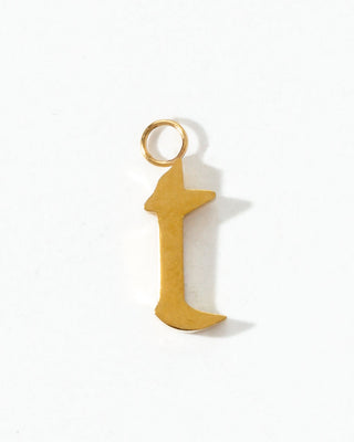 Gold letter 't' charm on a white background