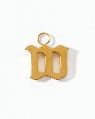 Gold letter 'm' pendant on a white background