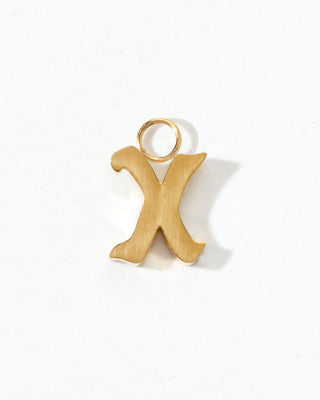 Gold letter 'X' pendant on a white background
