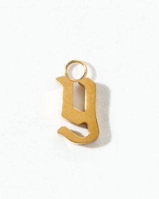 Gold letter 'y' charm on a white background