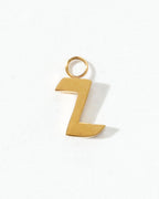 Gold letter 'Z' charm on a white background
