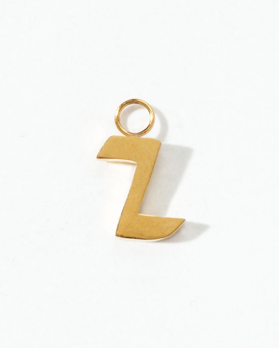 Gold letter 'Z' charm on a white background