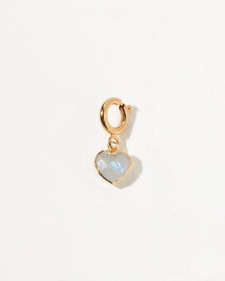 Gold heart-shaped pendant with a rainbow moonstone on a white background