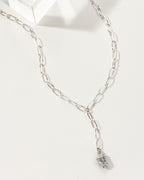 Silver chain necklace with a pendant on a white background