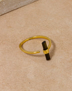 Gold ring featuring a green watermelon tourmaline gemstone.