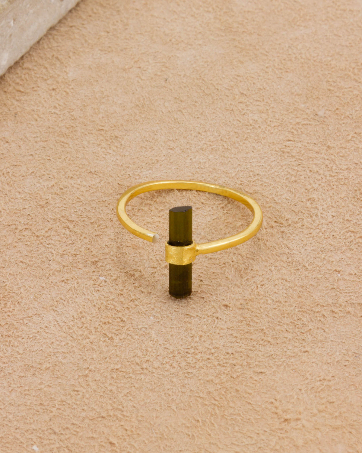 Lasso Watermelon Tourmaline Ring with a green tourmaline stone on a gold band.
