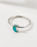 Sterling silver Moondance ring with a turquoise crescent moon detail.