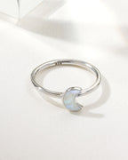 Sterling silver ring featuring a moonstone crescent accent.