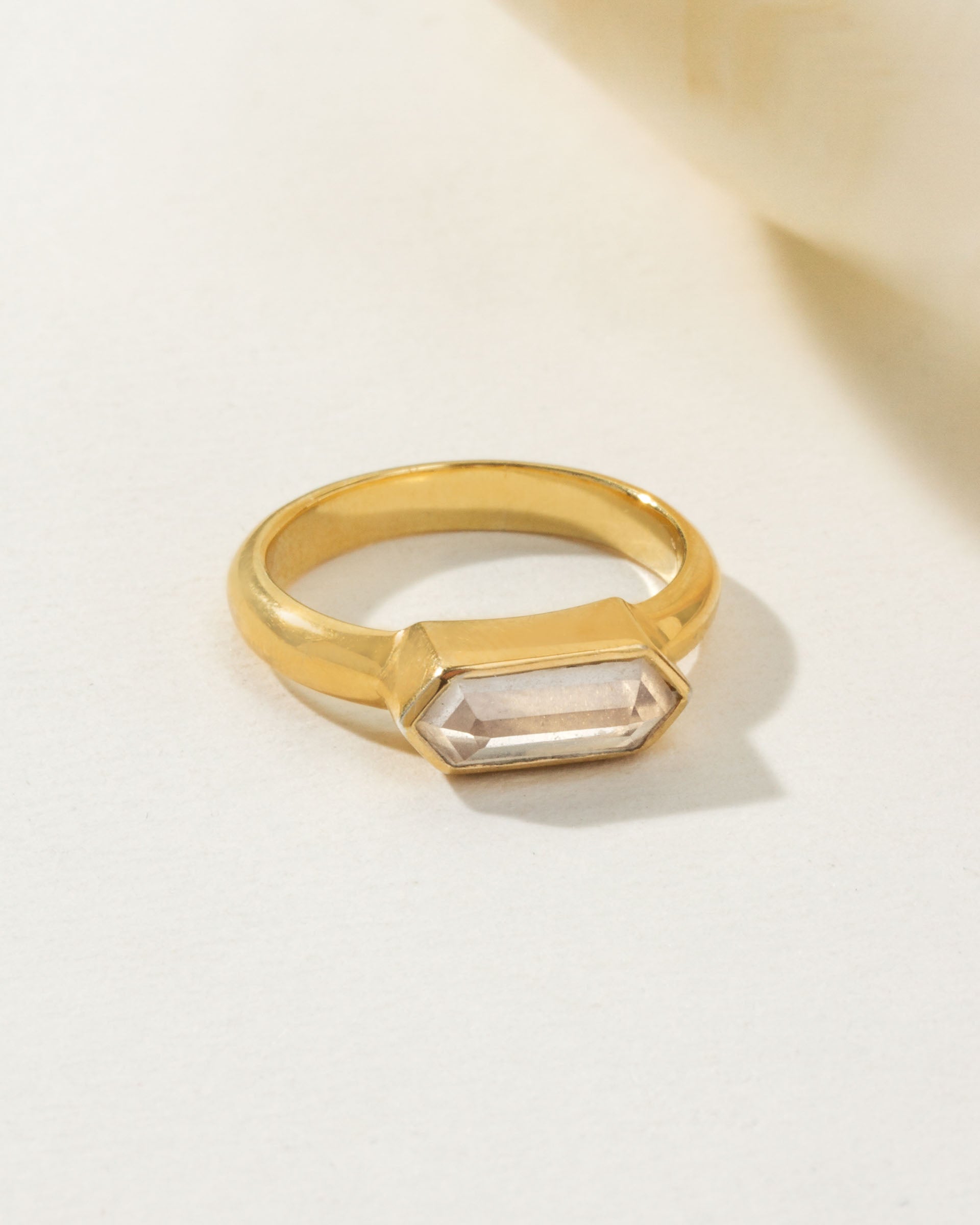 Gold Kaleidoscope ring with a Clear Quartz gemstone.