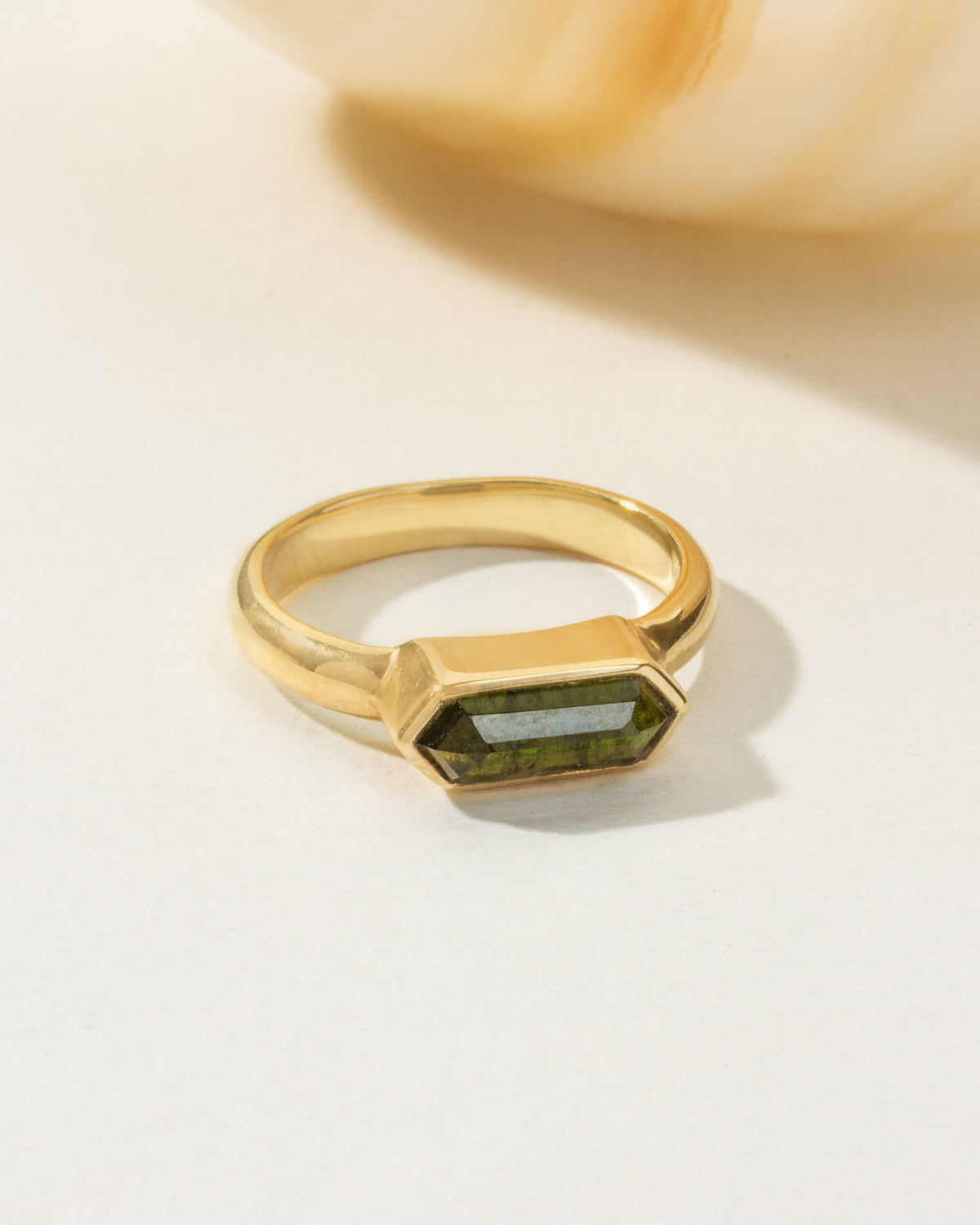 Gold Kaleidoscope Ring with a green tourmaline gemstone.