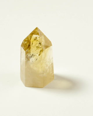 Yellow crystal on a white background