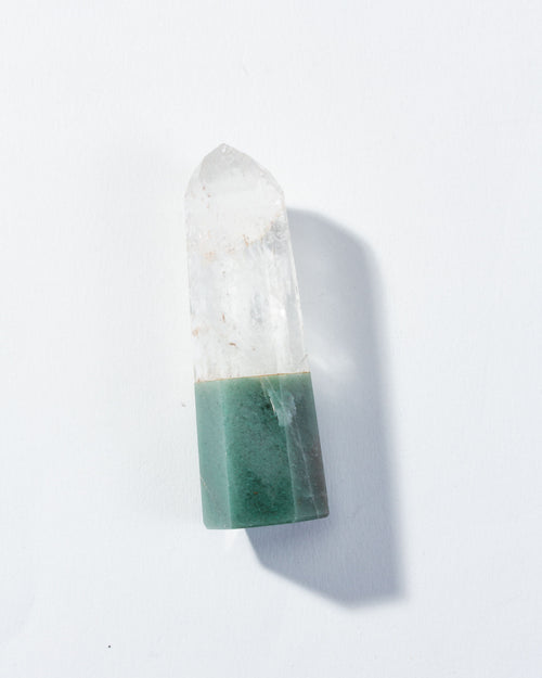 Crystal with green base on a white background