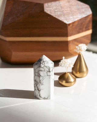 Marble-textured crystal and gold decorative objects.