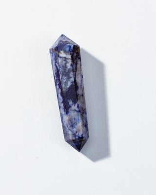 Blue crystal prism on a white background