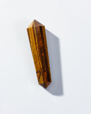 Tiger's eye crystal on a white background