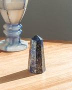 Crystal pyramid on a wooden surface