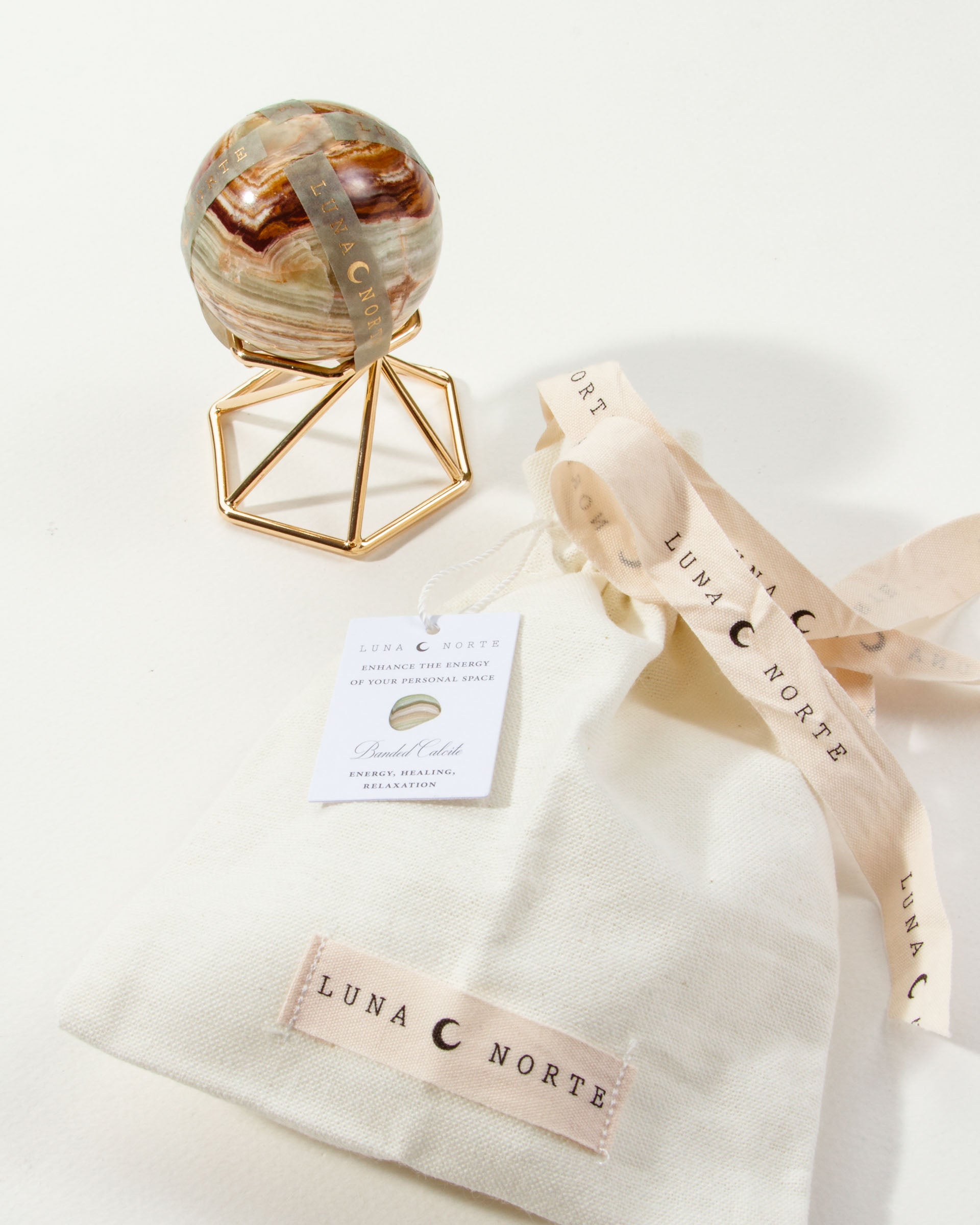 Banded Calcite sphere with stand, pouch, and ribbon.