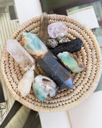 Wicker basket with various crystals on a neutral background