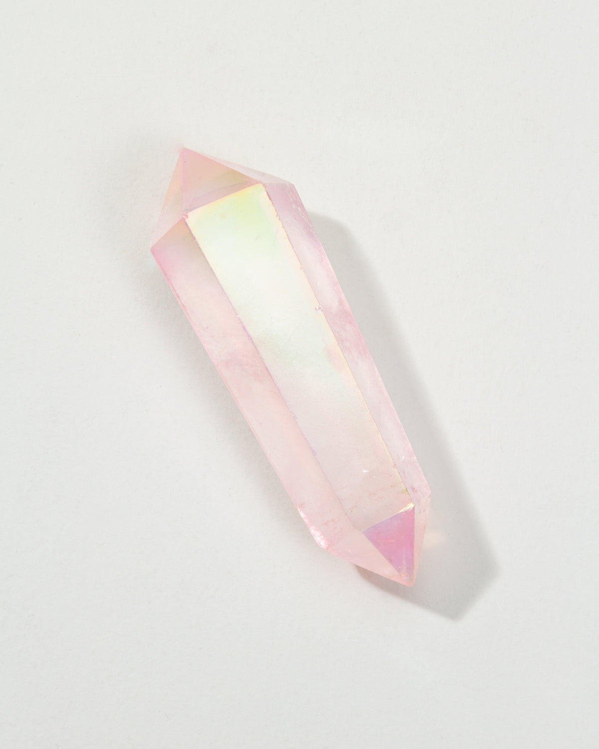 Pink Pop Star Quartz Double Point Crystal on a white surface.
