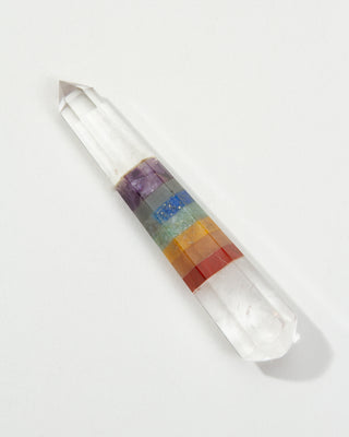 Crystal with colored bands on a white background