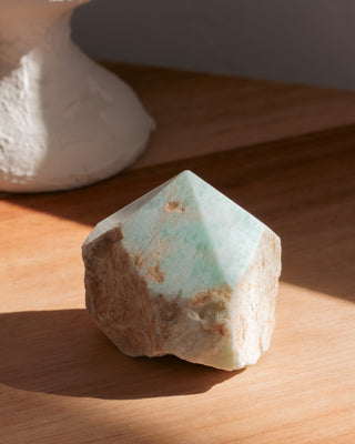 Geometric stone on a wooden surface 