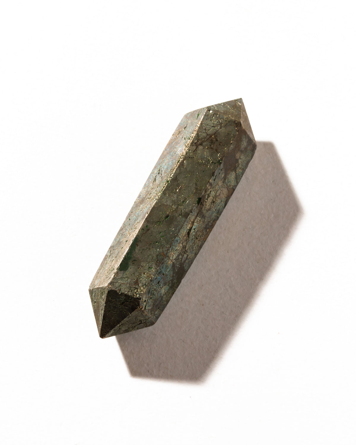 A pyrite crystal in a double-pointed shape with a metallic sheen is displayed.