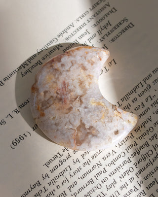 Mineral specimen on an open book